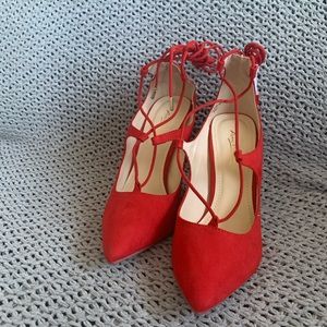 Red pointed toe heels